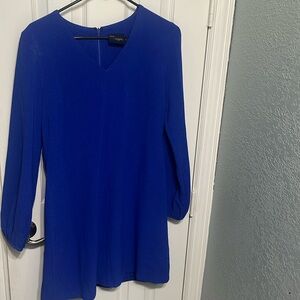 Blue dress long sleeve, cuffed at wrist.